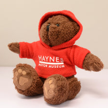Load image into Gallery viewer, Charlie Bear with Hoodie - Haynes Motor Museum Logo