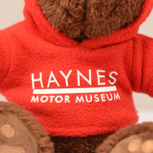 Load image into Gallery viewer, Charlie Bear with Hoodie - Haynes Motor Museum Logo

